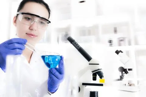 Laboratory assistant analyzing a sample Stock Photos