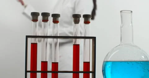 Laboratory assistant checks test tube with blood. Medications and vaccine Video stock 168009880