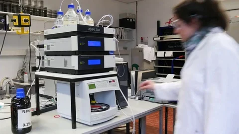 Laboratory assistant during her work at the Autosampler in the institute. Stock Footage 69305406