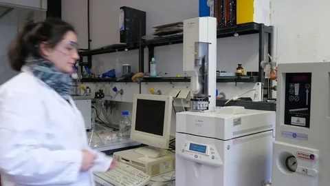 Laboratory assistant during her work at the Autosampler in the institute. Stock Footage 69309407