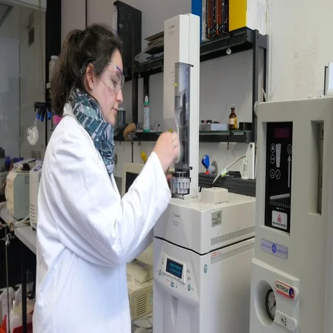 Laboratory assistant during her work at the Autosampler in the institute. Stock Footage 69356919