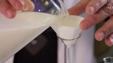 Laboratory assistant examines dairy products Stock Footage 75224838