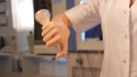 The laboratory assistant holds a flask Stock Footage 74578687