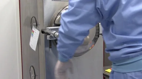 Laboratory Assistant in Laboratory Lay the Box in Special Barocamera Autoclave Stock Footage 75626026