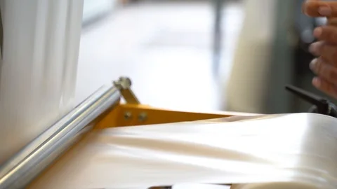 Laboratory assistant in the production of polyethylene measures the thickness of Stock-Footage 123435184
