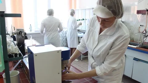 The laboratory assistant takes the biological material from the laboratory Stock Footage 128374579