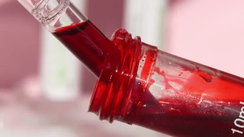 A laboratory assistant takes a blood sample from a test tube. The concept of Stock Footage 221147817