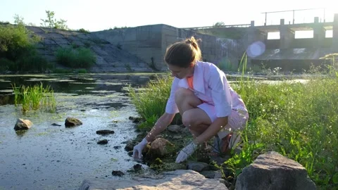 A laboratory assistant takes water samples from the reservoir Video stock 168552917