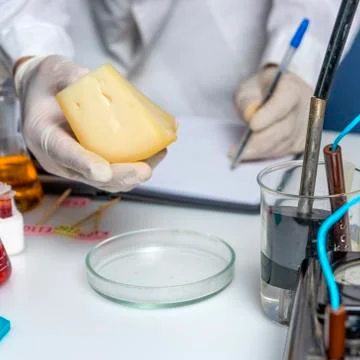 Laboratory assistant at the workplace makes notes in a notebook. Laboratory p Stock Photos