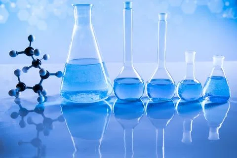 Laboratory beakers,Science experiment, blue background Stock Photos