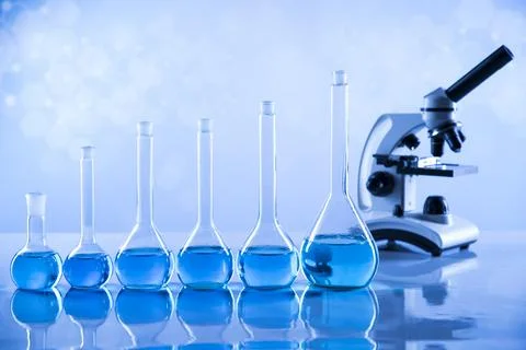 Laboratory beakers,Science experiment, blue background Stock Photos