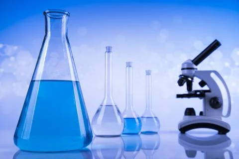 Laboratory beakers,Science experiment, blue background Stock Photos