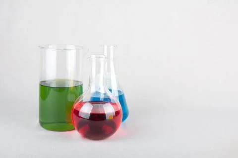 Laboratory bottles with colored liquid Stock Photos