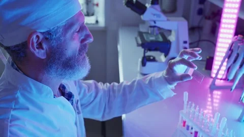 Laboratory Chemist Analyzing Chemical Samples Under Neon Lights Stock Footage 281314102