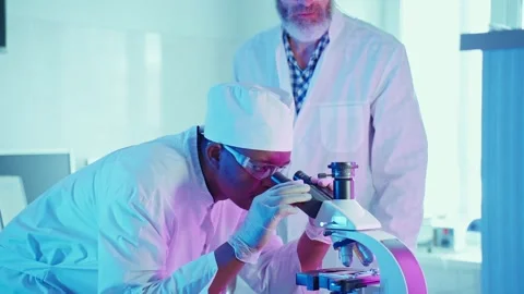 Laboratory Chemists Analyzing Innovative Technology Under Neon Lighting Video stock 281313385