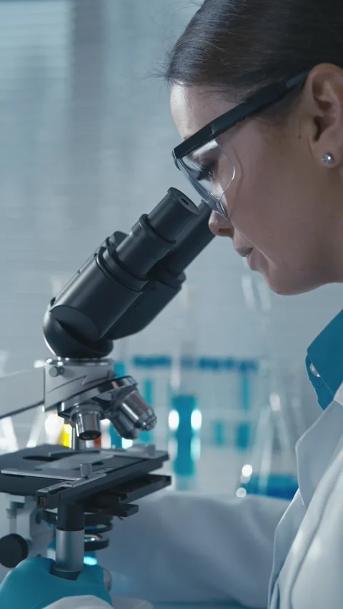 In the laboratory, a clinical pharmacist tests the quality and efficacy of Stock Footage 272637720