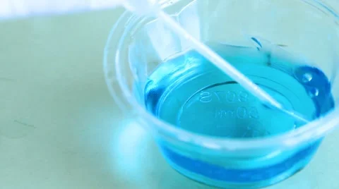 Laboratory dish with blue liquid Stock Footage 8690713