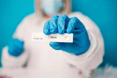 A laboratory employee taking sample PCR microtubes with cotton swab test Foto stock