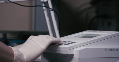 Laboratory equipment. The hand presses the button 库存影片 63130076