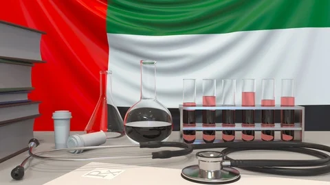 Laboratory equipment on the UAE flag background. Healthcare and medical research Stock Footage 123630802