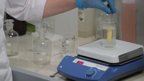 Laboratory Experiment Using Magnetic Stirrer and Beaker Stock Footage 306319331