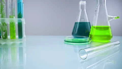 Laboratory flasks and test tubes with green and blue liquids Stock Footage 311461188