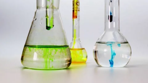 Laboratory flasks with liquid close-up on a white background. Medical laboratory Stock Footage 170640050