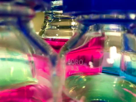 Laboratory flasks with pink substance Stock Photos