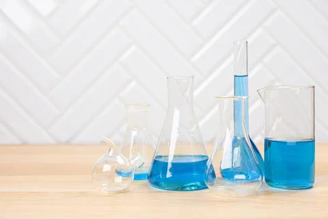 Laboratory glassware with test tubes. flasks, dropper, petri dishes, measurin Stock Photos