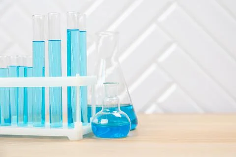 Laboratory glassware with test tubes. flasks, dropper, petri dishes, measurin Stock Photos