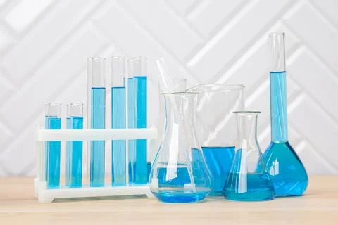 Laboratory glassware with test tubes. flasks, dropper, petri dishes, measurin Stock Photos