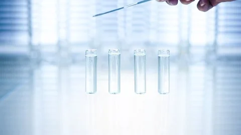 Laboratory. Hand throws tubes purple powder Stock Footage 61272239