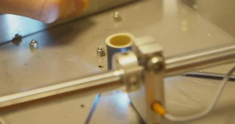 Laboratory instrument cutting a slice of cable to run a quality test 스톡 동영상 155015651