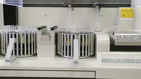 Laboratory machine for analysis of urinalysis. Test tubes close-up. Stockbeeldmateriaal 85900417