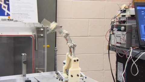 Laboratory machine moving back and forth Stock Footage 99053001