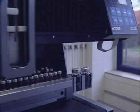 Laboratory machine small bottles with fluid specimen Stock Footage 56852244