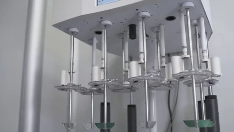 Laboratory, medical machine mixes liquid samples of drug substance. Stock Footage 84367884