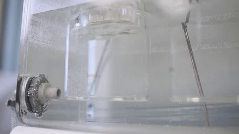 Laboratory, medical machine mixes liquid samples of drug substance. Stock Footage 84371260