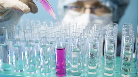 Laboratory medical worker using a pipette and test tube  Stock Footage 123673042