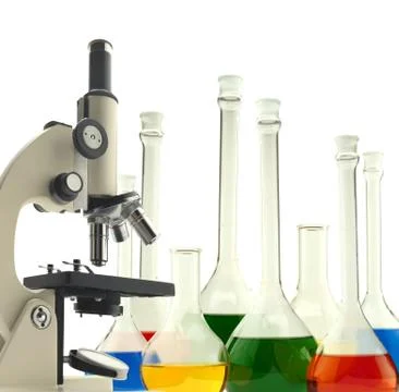 Laboratory metal microscope and test tubes with liquid isolated on white Foto stock