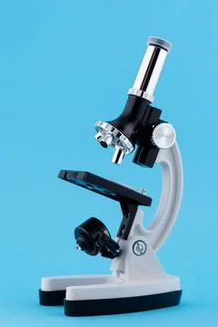 Laboratory Microscope on blue background Stock Photos