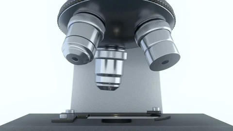 Laboratory microscope in bright white laboratory rotating its metal lenses Stock Footage 115204937