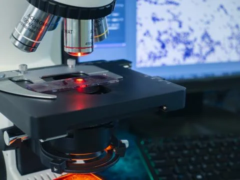 The laboratory microscope is controlled by a computer program Stock Photos