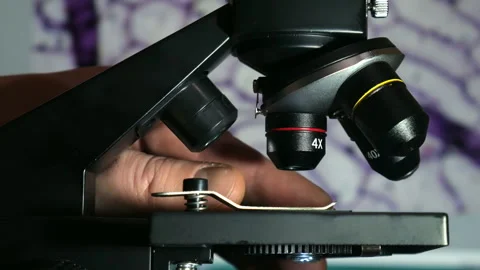 Laboratory Microscope with Digital Cell Image on background Computer Screen Stock Footage 327733670