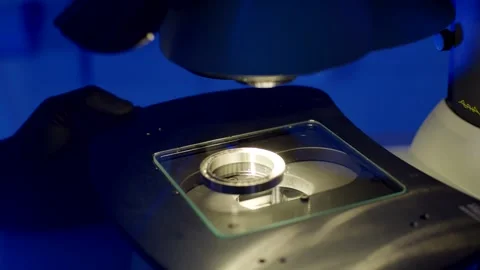 Laboratory Microscope Examining Metal Sample, Blue Lab Light, Close Up Shot Stock-Footage 341488241