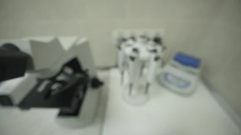 Laboratory microscope is in scientist's office. Medical research of virus and Stock Footage 129686171