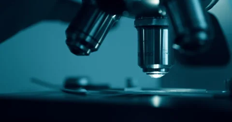 Laboratory optical microscope macro view with gloved hands Stock Footage 320890832