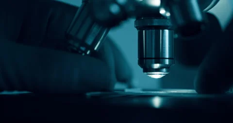 Laboratory optical microscope macro view with gloved hands Stock Footage 320890896