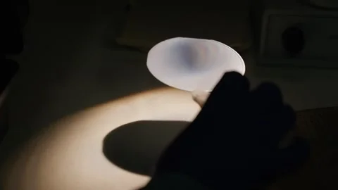 Laboratory optics experiment showing a circular filter shaping a focused light Stock Footage 325866339