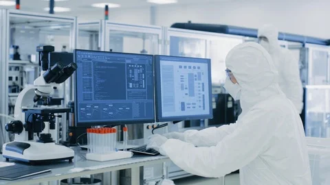 In Laboratory Over the Shoulder View of Scientist in Protective Clothes, Working Stock Footage 93224656